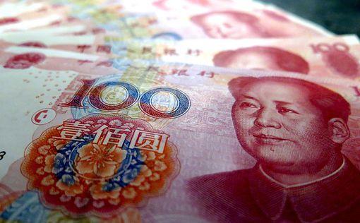 Юань достиг рекордно низкого уровня по отношению к доллару